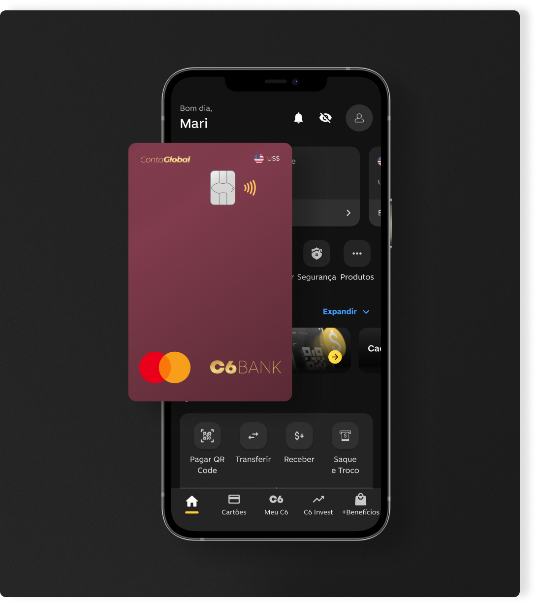 Cartão C6 Conta Global Dólar em frente a um celular aberto no app C6 Bank