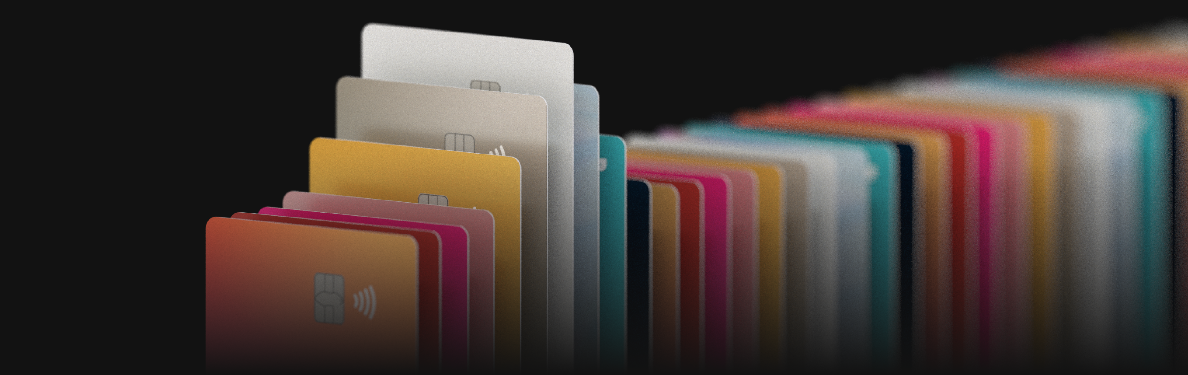 Cartões Diversos cartões do C6 Bank enfileirados em uma grande variedade de cores.