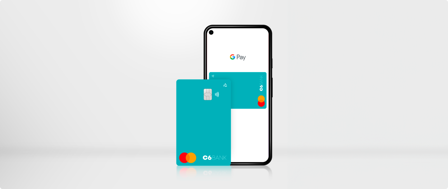 Cartão Acqua do C6 Bank na frente de um celular com a tela da Carteira do Google aberta