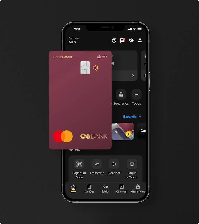 Cartão C6 Conta Global Dólar em frente a um celular aberto no app C6 Bank