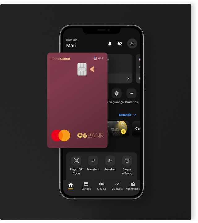 Cartão C6 Conta Global Dólar em frente a um celular aberto no app C6 Bank
